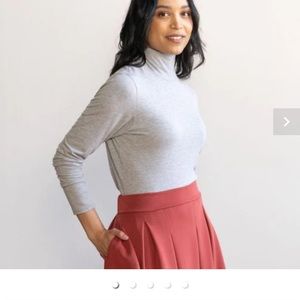 The Effortless Merino Turtleneck in light heathered grey